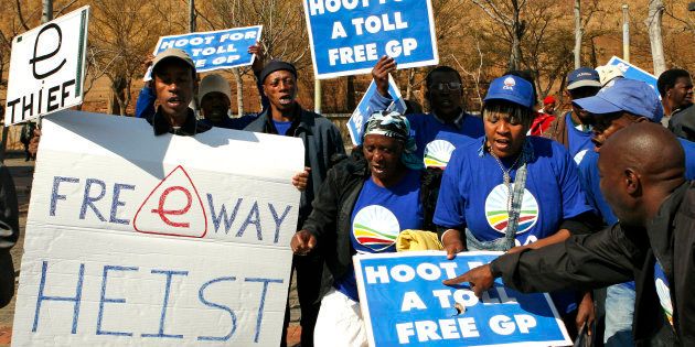 Democratic Alliance (DA) supporters protest against the electronic road tolling system outside the Constitutional Court in Johannesburg, South Africa on Wednesday, Aug. 15, 2012.