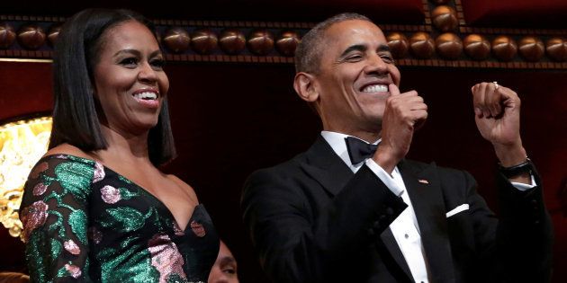 U.S. President Barack Obama gestures as he and first lady Michelle Obama attend the Kennedy Center Honors in Washington, U.S., December 4, 2016. REUTERS/Yuri Gripas