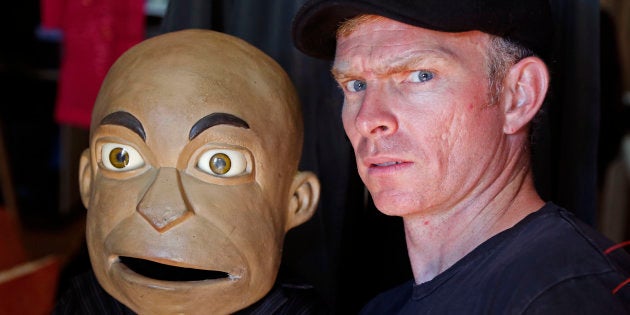 South African comedian Conrad Koch poses for a photograph with his puppet named Chester Missing, at his home in Cape Town, South Africa, Monday, Nov. 10, 2014.