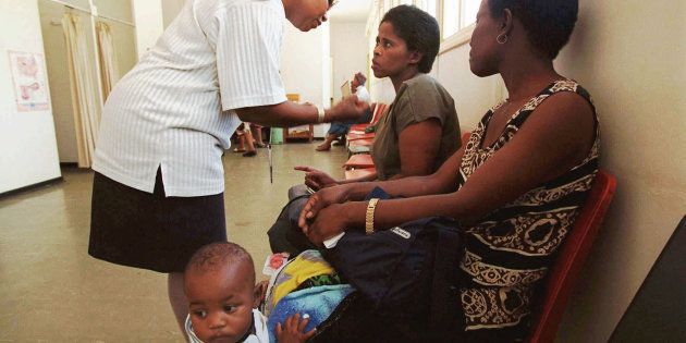 A nurse, left, explains to patients, right, that abortion proceedures are only performed during the week at the Chris Hani-Baragwanath Hospital in Soweto, South Africa in this Feb. 1997 file photo.