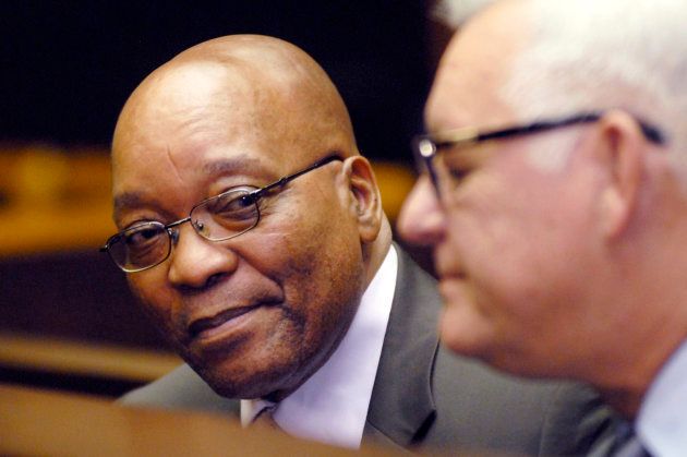 Jacob Zuma and arms company Thint's boss Pierre Moynot talk in the dock at the Pietermaritzburg High Court, February 4, 2009.
