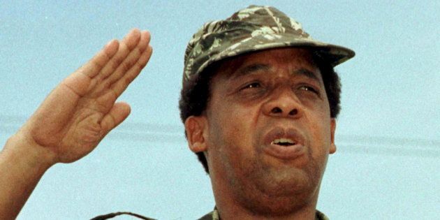 South African Communist Party leader Chris Hani salutes at a rally of the African National Congress (ANC) in this file picture taken December 16, 1991.