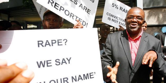 Mbuyiselo Botha, leader of the Sonke Gender Justice Network is seen outside the Johannesburg Equality Court on March 15, 2010 in Johannesburg, South Africa. South African politician Julius Malema has been convicted of hate speech after after making allegations that the woman who accused President Jacob Zuma of rape had a 'nice time' because she had stayed for breakfast and asked for money for a taxi home. The court ordered Malema to make an unconditional public apology within two weeks and pay an amount of R50,000 to a centre for abused women.