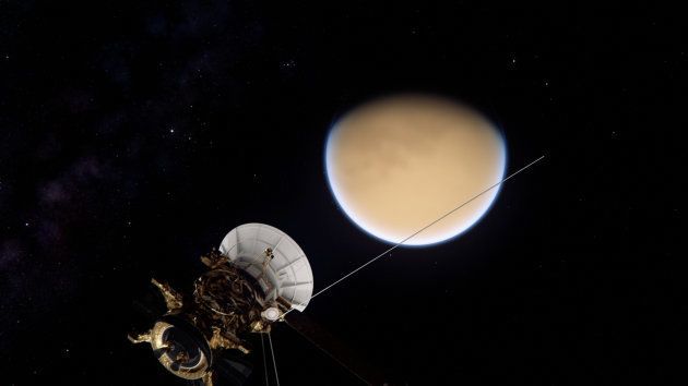 The Cassini spacecraft approaches Saturn's largest moon Titan.