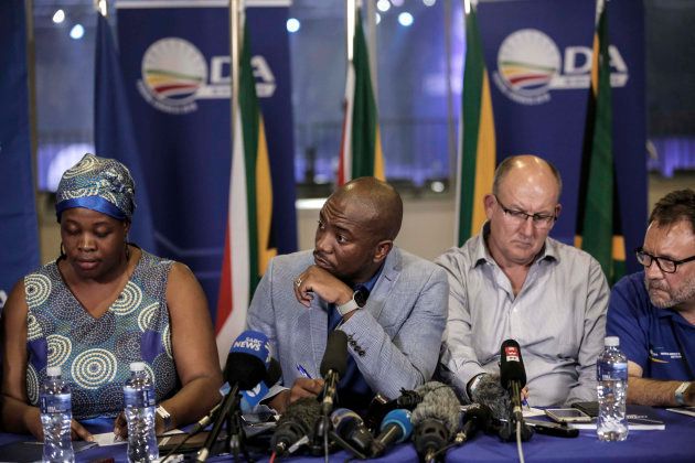 South African opposition party DA leadership (L-R) deputy chairperson Refiloe Nt'sekhe, president Mmusi Maimane, federal chairperson Atholl Trollip (Photo by: GULSHAN KHAN/AFP/Getty Images)