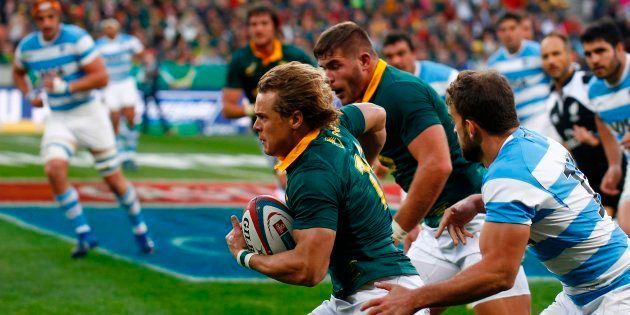 Springboks full-back Andries Coetzee (C) runs with the ball during the International Rugby Test match between Argentina and South Africa at The Nelson Mandela Bay Stadium in Port Elizabeth on August 19, 2017. / AFP PHOTO / MICHAEL SHEEHAN (Photo credit should read MICHAEL SHEEHAN/AFP/Getty Images)