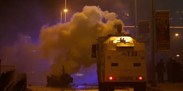 Smoke rises from a car after a blast in Istanbul, Turkey, December 10, 2016.