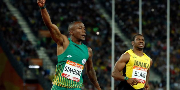 Akani Simbine and Yohan Blake of Jamaica after the men's 100m final at the 2018 Commonwealth Games. REUTERS/Jeremy Lee