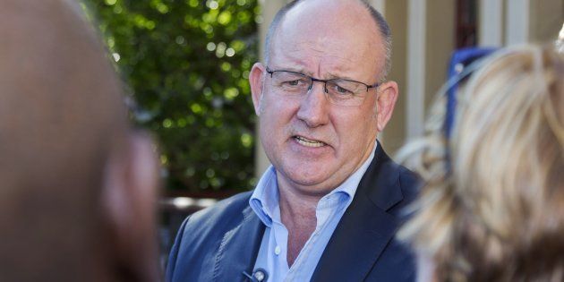 Nelson Mandela Bay municipal mayor Athol Trollip addresses supporters and journalists during a rally outside the mayor's office on April 14, 2016 in Port Elizabeth.