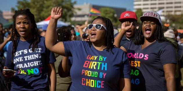 Members of the South African Lesbian, Gay, Bisexual and Transgender and Intersex (LGBTI) community chant slogans as they take part in the three-day Durban Pride Festival.