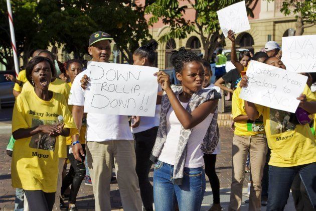 ANC supporters demonstrate against DA mayoral candidate for Nelson Mandela Bay municipality, Athol Trollip during his campaign rally outside the mayor's office on April 14, 2016 in Port Elizabeth.