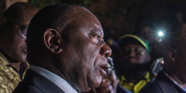 President Cyril Ramaphosa speaks to journalists outside of the home of late anti-apartheid stalwart Winnie Madikizela-Mandela, outside of Johannesburg, on April 2, 2018.