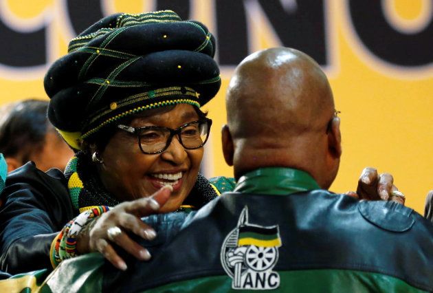 Winnie Madikizela Mandela, ex-wife of former South African president Nelson Mandela, smiles as she embraces South Africa's president Jacob Zuma ahead of the 54th National Conference of the ruling African National Congress (ANC) at the Nasrec Expo Centre in Johannesburg, South Africa December 16, 2017.