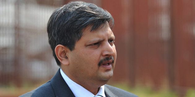 Atul Gupta stands outside the Randburg Magistrate's court on September 27, 2010 in Johannesburg, South Africa.