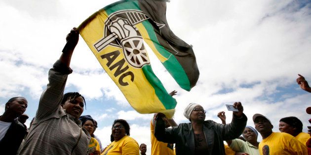 Disgruntled members of the ruling African National Congress tear up an ANC flag as they gather in Cape Town to resign from the party in 2008. REUTERS/Stringer