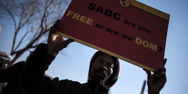 A Protester rallies with others outside the Constitutional Court on 1 July 2016 in Johannesburg to protest against alleged bias and self-censorship in news coverage by the South African Broadcasting Corporation (SABC) ahead of key municipal elections.