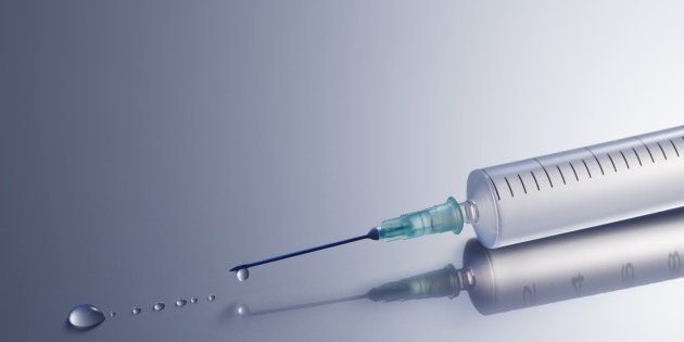 Syringe with water droplets