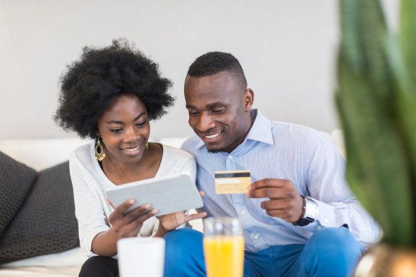 African couple doing an internet banking, Cape Town, South Africa