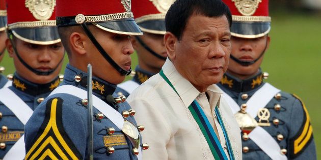 Philippine President Rodrigo Duterte walks with cadets of the Philippine Military Academy during the Armed Forces anniversary celebration at Camp Aguinaldo in Quezon city, Metro Manila December 21, 2016.