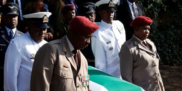 The coffin of Winnie Madikizela-Mandela is carried from her home ahead of her funeral in Soweto.