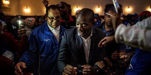 South African opposition party Democratic Alliance (DA) provincial leader John Moodey (L) looks on as Mmusi Maimane, the leader of the DA party dances with supporters during a rally at the Johannesburg City Hall in 2016. Photo: MARCO LONGARI/AFP/Getty Images