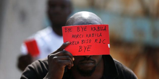 A Congolese opposition party supporter displays a red card against President Joseph Kabila in Kinshasa, Democratic Republic of Congo on 19 December 2016.