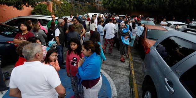 People gather inside a residential area after a tremor was felt in Mexico City, Mexico, September 23, 2017. REUTERS/Edgard Garrido