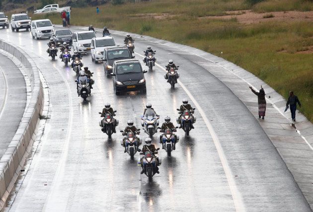 People pay their respects as Winnie Madikizela-Mandela's funeral cortege leaves for the burial site after her funeral service in Soweto, South Africa April 14, 2018. REUTERS/Rogan Ward