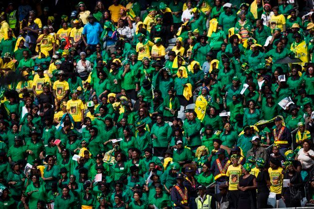 TOPSHOT - African National Congress (ANC) Women's League members attend the funeral of anti-apartheid icon Winnie Madikizela-Mandela, at the Orlando Stadium in the township of Soweto, concluding 10 days of national mourning on April 14, 2018, in Johannesburg. South Africans turned out in their thousands to bid final goodbyes to the anti-apartheid icon and Nelson Mandela's former wife who was laid to rest with full state honours. Winnie Mandela, who died in Johannesburg aged 81 on April 2 after a long illness, has been celebrated for helping keep Nelson Mandela's dream of a non-racial South Africa alive while he was behind bars for 27 years. / AFP PHOTO / WIKUS DE WET (Photo credit should read WIKUS DE WET/AFP/Getty Images)