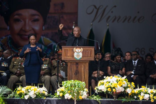 Firebrand opposition politician Julius Malema, leader of the Economic Freedom Fighters, speaks during the funeral of anti-apartheid champion Winnie Madikizela-Mandela, at the Orlando Stadium in the township of Soweto, concluding 10 days of national mourning on April 14, 2018, in Johannesburg. South Africans turned out in their thousands to bid final goodbyes to anti-apartheid icon and Nelson Mandela's former wife who was laid to rest with full state honours. Winnie Mandela, who died in Johannesburg aged 81 on April 2 after a long illness, has been celebrated for helping keep Nelson Mandela's dream of a non-racial South Africa alive while he was behind bars for 27 years. / AFP PHOTO / WIKUS DE WET (Photo credit should read WIKUS DE WET/AFP/Getty Images)