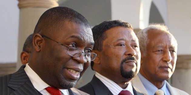 Sydney Mufamadi (L) – then SA's Minister of Safety and Security – addresses the media next to African Union Commission chairman Jean Ping (C) and United Nations' special representative to Zimbabwe Haile Menkerios (R) in Pretoria on July 18, 2008.