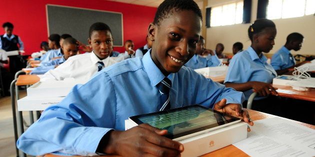 Pupils work on their tablets on January 13, 2015 at Boitumelong Secondary School in Tembisa in Johannesburg, South Africa.