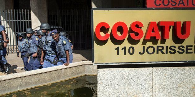 South African police officers escort University of Witwatersrand students as they march to the Cosatu headquarters in Johannesburg last year during a protest to demand free higher education.The South African government vowed on September 22 to end violent student protests against higher tuition fees, after days of clashes on campuses and disrupted classes across the country.