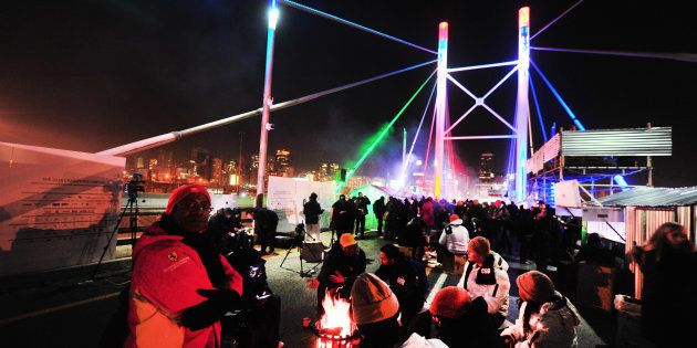 People gather for the Sun International CEO SleepOut initiative at the Nelson Mandela bridge on July 29, 2016 in Johannesburg, South Africa.