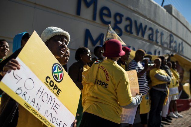 Members of South African political party Congress of the People (COPE) demonstrate outside state entity Eskom Offices at Megawatt Park against the re-instatement of Brian Molefe as Eskom CEO on May 15, 2017.