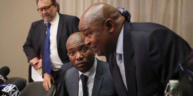 Leader of South Africa's Democratic Alliance Mmusi Maimane looks on next to Congress of the People leader Mosiuoa Lekota, ahead of a media briefing in Sandton, Johannesburg in August.