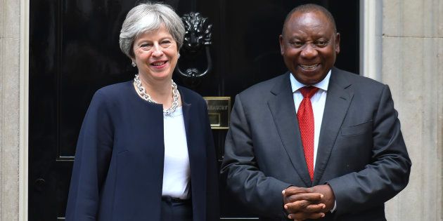 Britain's Prime Minister Theresa May (L) greets South Africa's President Cyril Ramaphosa at 10 Downing Street in central London, prior to bilateral talks on the sidelines of the Commonwealth Heads of Government meeting (CHOGM) on April 17, 2017.