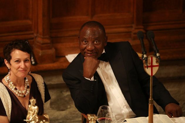 South Africa's President Cyril Ramaphosa is seen next to Lloyds of London chief executive officer Inga Beale during the Commonwealth Business Forum Banquet at the Guildhall in London, U.K., April 17, 2018.