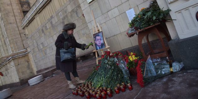 Pepole bring flowers for killed Russian Ambassador to Turkey Andrei Karlov, outside the Foreign Ministry headquarters, in Moscow, Russia, on December 20, 2016. Mr Karlov was shot dead during the launch of a photography exhibition in Ankara by off-duty police officer Mevlut Mert Altintas.(Photo by Dmitry Ermakov/NurPhoto via Getty Images)