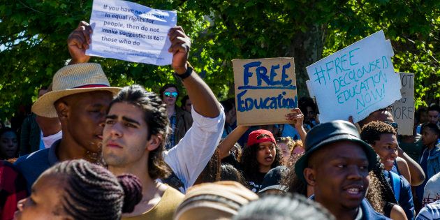 University of Cape Town students march during the #FeesMustFall protest on October 03, 2016 in Cape Town, South Africa. Speaking during a #FeesMustFall imbizo.