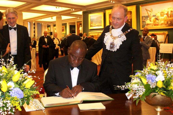 President Cyril Ramaphosa signing a vistor's book in London on Wednesday.