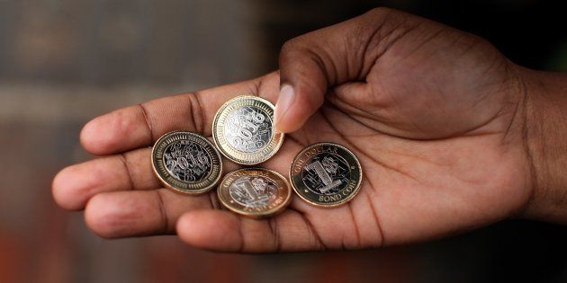 A man shows new coins as Zimbabwe Central bank launches new banknotes due to economical crisis in the country and decreasing of cash stores, in Harare, Zimbabwe on November 28, 2016.