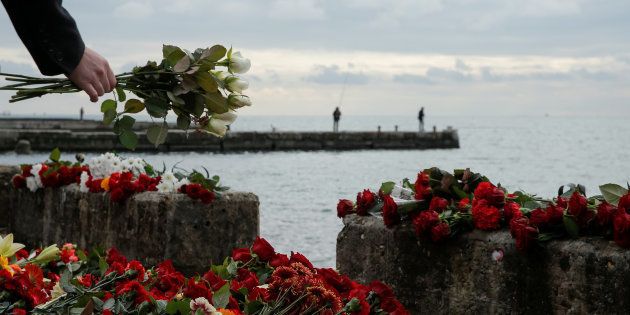 In the Black Sea resort city of Sochi in Russia, flowers are laid in memory of passengers and crew members of the Russian military Tu-154, which crashed into the Black Sea on its way to Syria on Sunday.