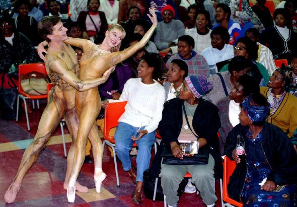 Capab Ballet principal dancers Johan Jooste (L) and Carol Kinsey perform to students at the Good Hope College of Education in the township of Khayelitsha near Cape Town June 1.