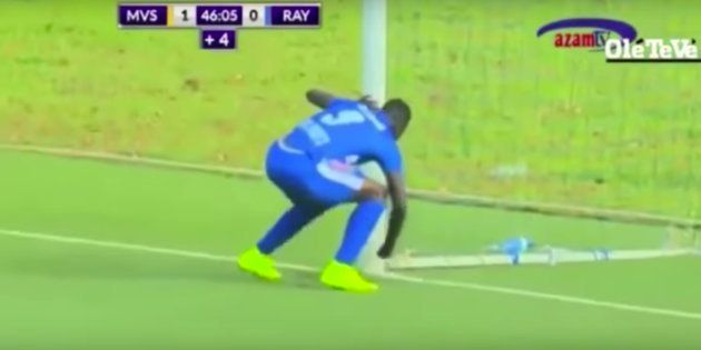 Mukura Victory striker Moussa Camara allegedly inserting some kind of talismanic object into the ground in the opposing goal.