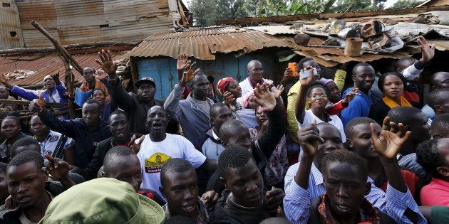 The faithful wave during Pope Francis' visit to the Kangemi slums on the outskirts of Kenya's capital Nairobi in November 2015. Developers are starting to build affordable homes in Kenya, regarded as critical to stop the spread of such slums.