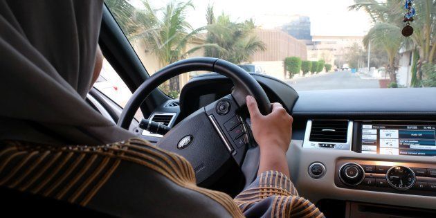 A Saudi woman drives her car in the coastal city of Jeddah on September 27 2017. Saudi Arabia will allow women to drive from June next year.