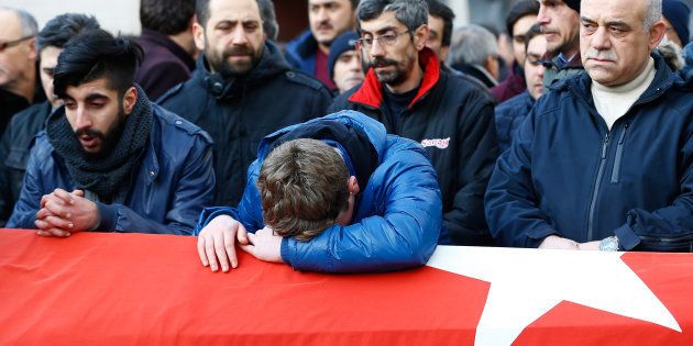 Relatives react at the funeral of Ayhan Arik, a victim of an attack by a gunman at Reina nightclub, in Istanbul, Turkey, January 1, 2017.