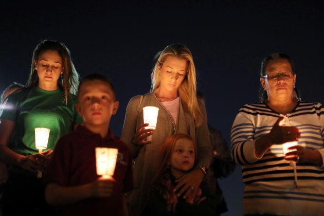 People pray during a candlelight vigil for victims of the Route 91 music festival mass shooting in Las Vegas, Nevada, on October 3 2017. (Lucy Nicholson, Reuters)