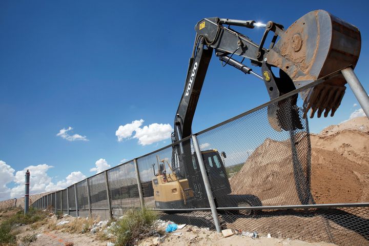 In this file photo, an excavator removes a fence, which will be replace by a section of the U.S.-Mexico border wall at Sunland Park, U.S. opposite the Mexican border city of Ciudad Juarez, Mexico, in August 2016.